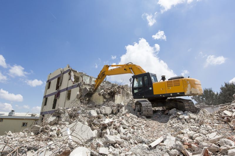 Excavator Demolishing Structure